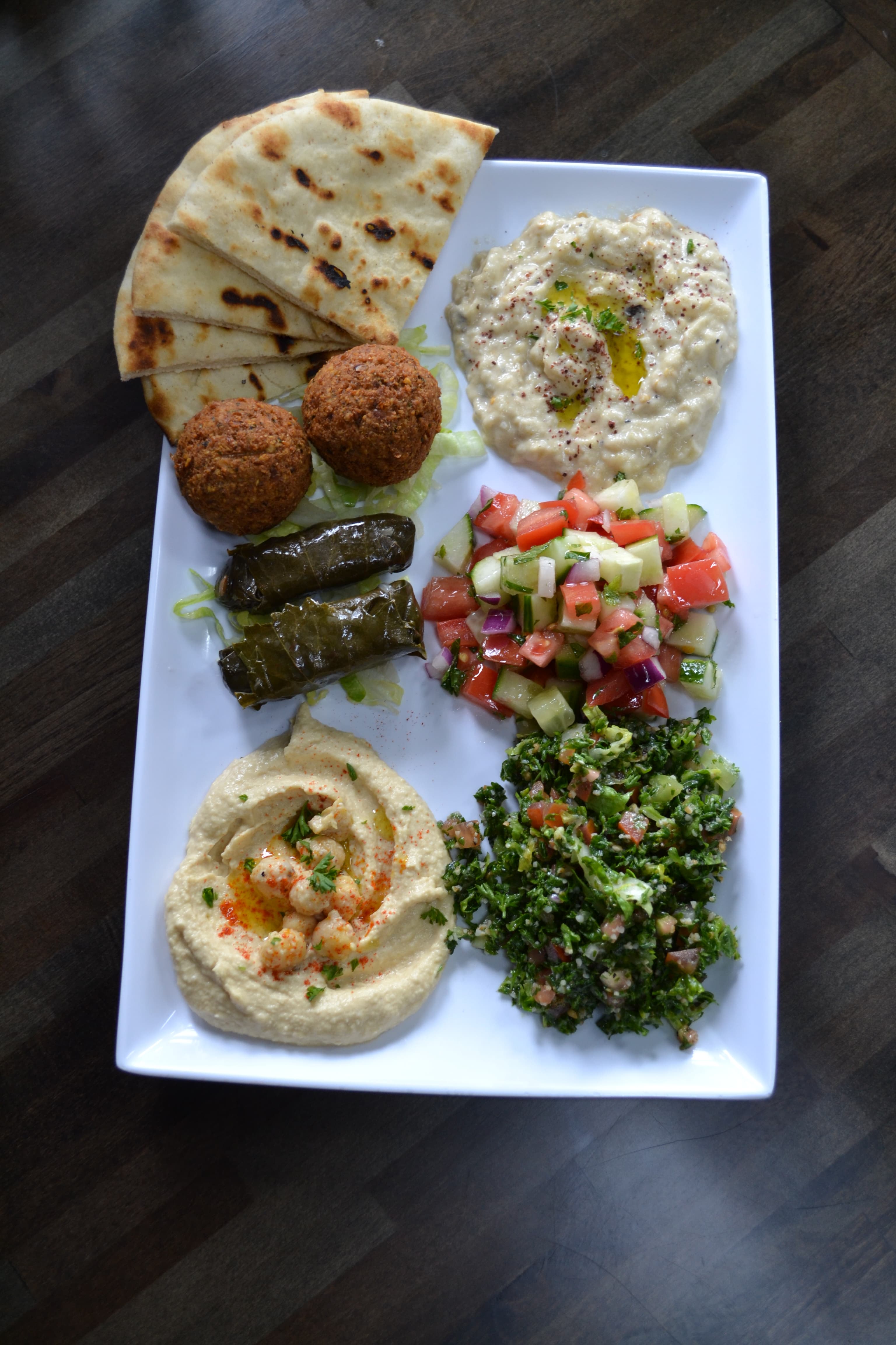 A Mediterranean platter with pita and sides